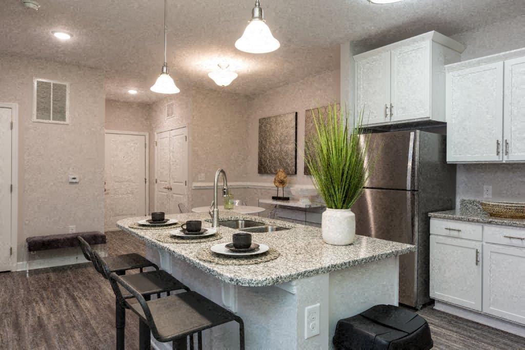 a kitchen with a sink and a counter top