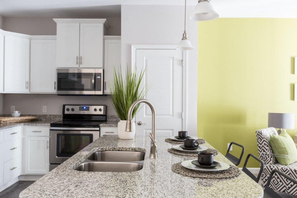 a kitchen with a granite counter top and a sink