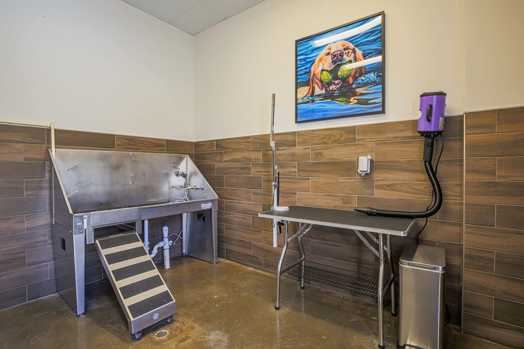 a kitchen with two stainless steel appliances and a painting on the wall