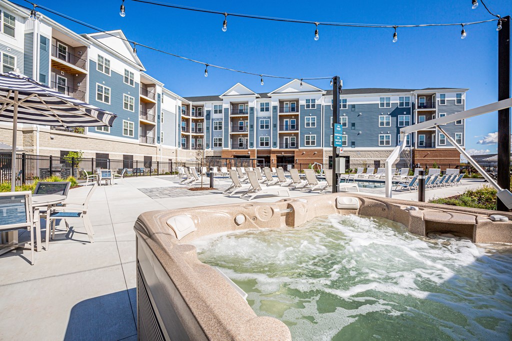 a jacuzzi with waves in front of an apartment building