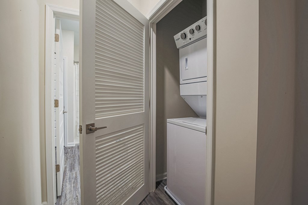 a small laundry room with a washer and dryer