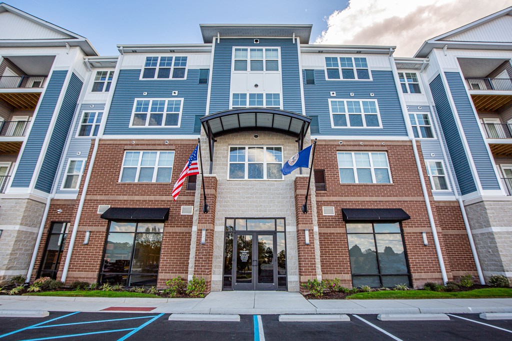the front of a building with an flag in front of it