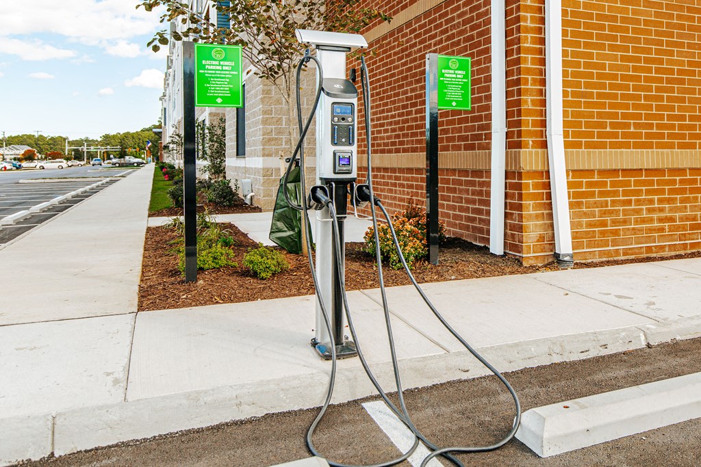 a charging station on the side of a brick building