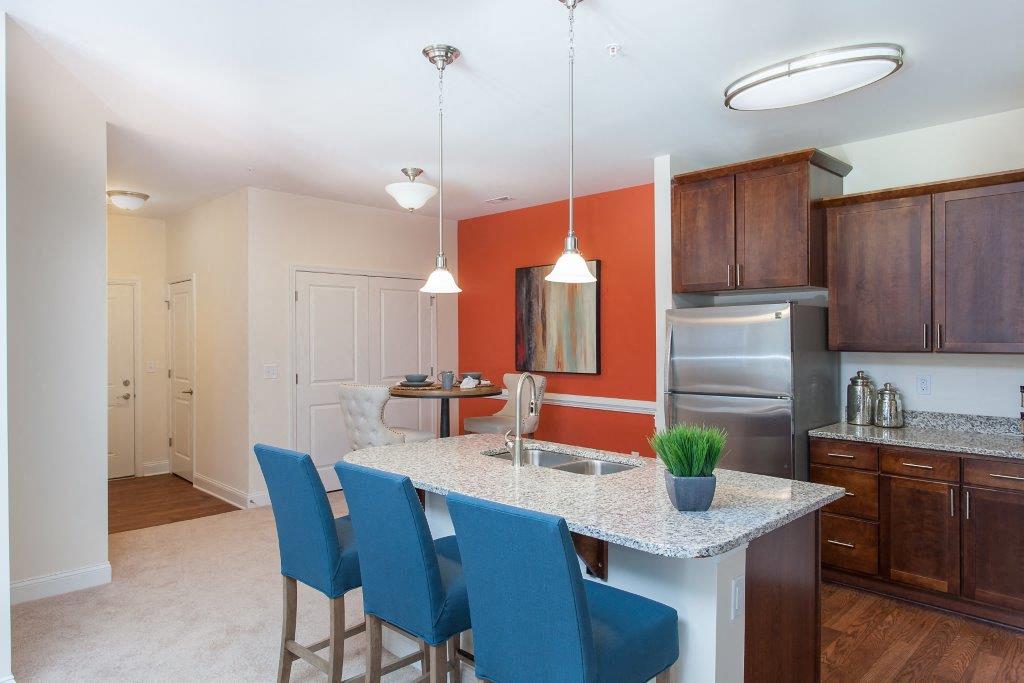 a kitchen with a marble counter top