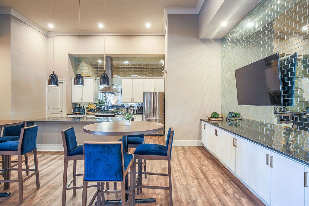 a kitchen and dining area with a table and chairs