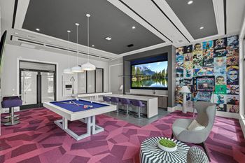 a game room with a pool table and a tv at Altis Grand Kendall, Miami