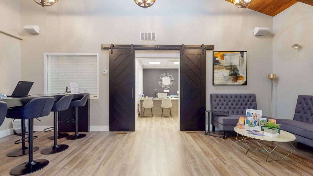 a conference room with a sliding barn door