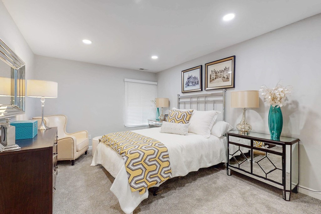 a bedroom with a bed and a desk