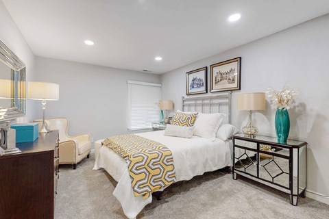 a bedroom with a bed and a desk
