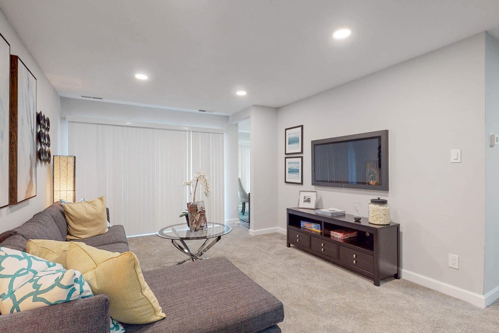 a living room with a couch and a tv