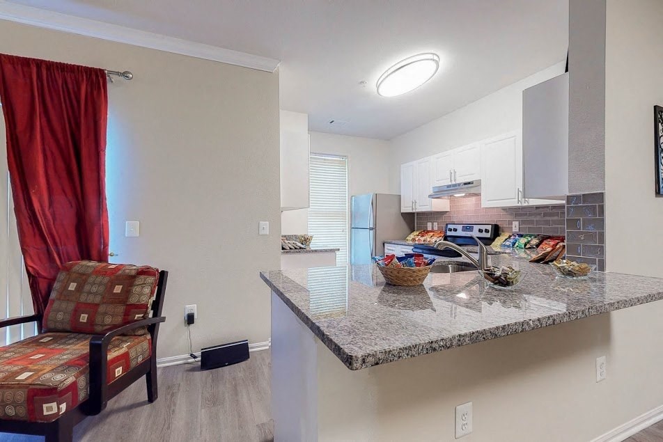 a kitchen with a counter top and a sink