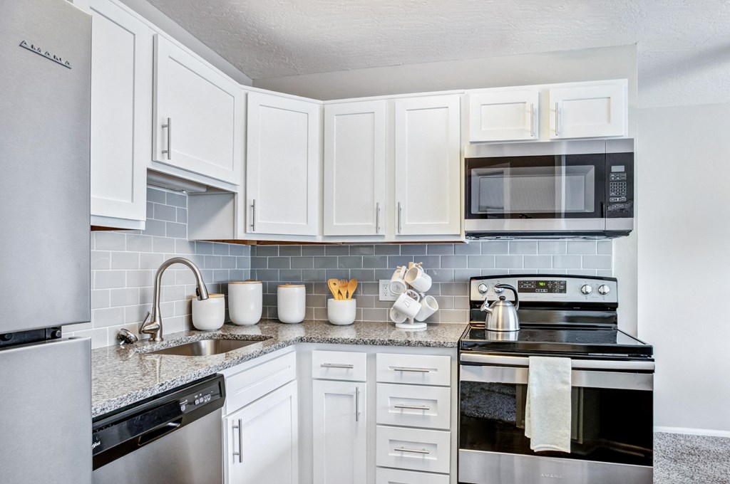 the preserve at ballantyne commons apartment kitchen with stainless steel appliances
