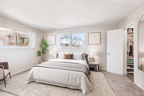 a bedroom with a bed and a closet