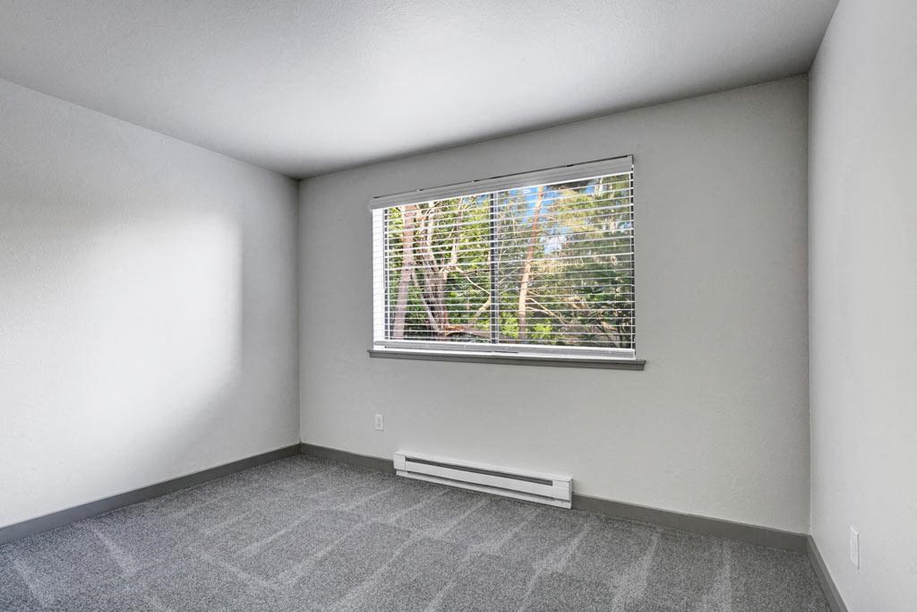 an empty room with a large window