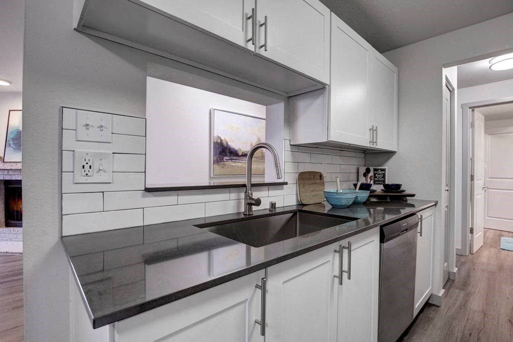 a kitchen with a sink and a dishwasher