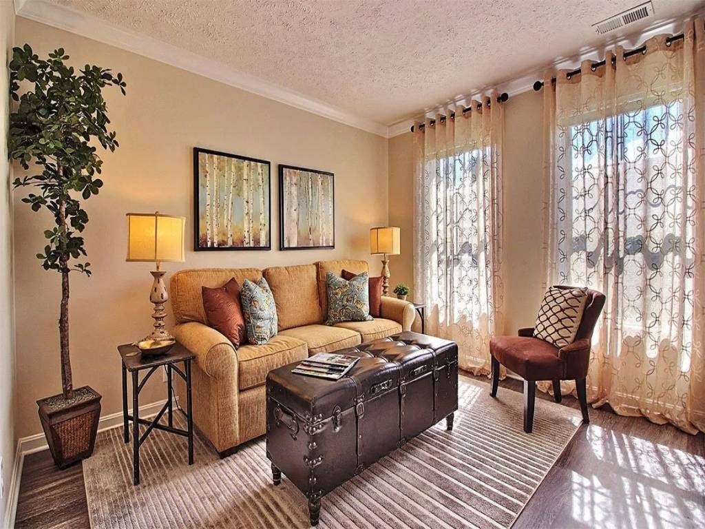 a living room with a couch and a trunk