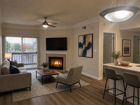A living room with a fireplace and a television mounted on the wall.