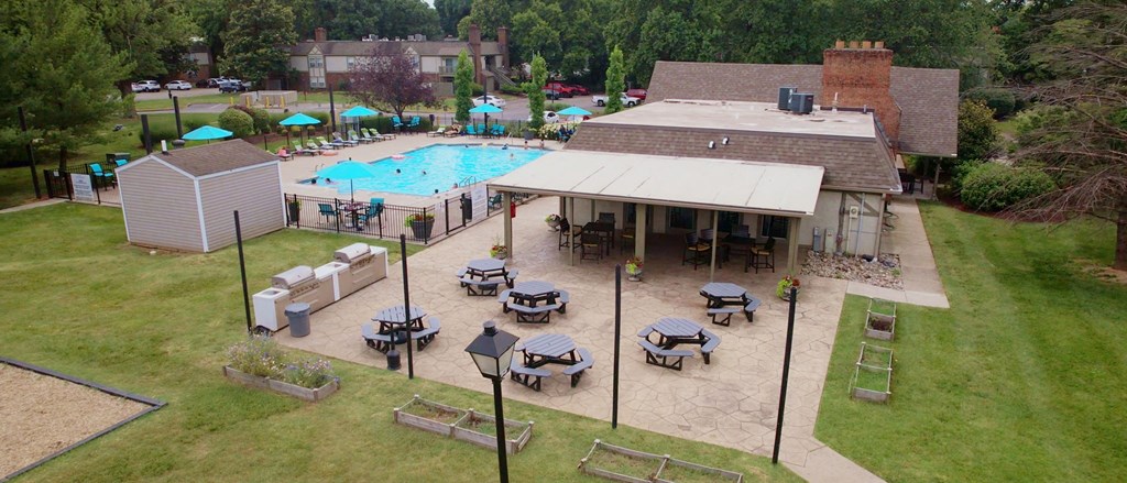 an aerial view of the pool and patio area of the club house at the resort