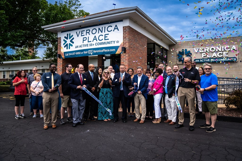 a group of people standing in front of a building