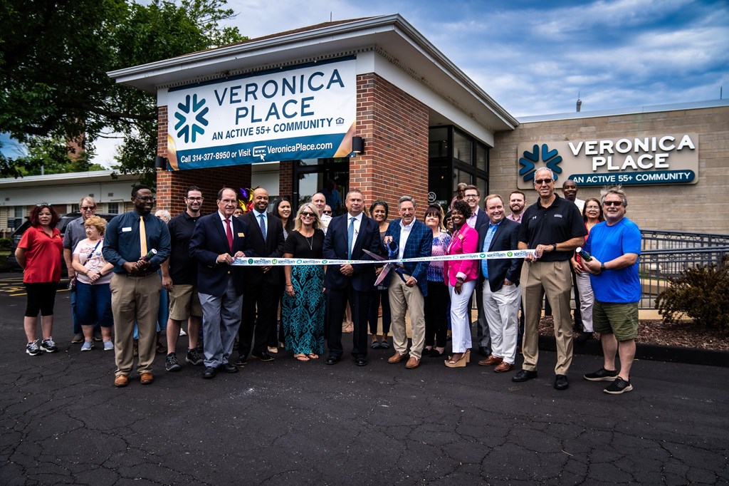 a group of people standing in front of a building