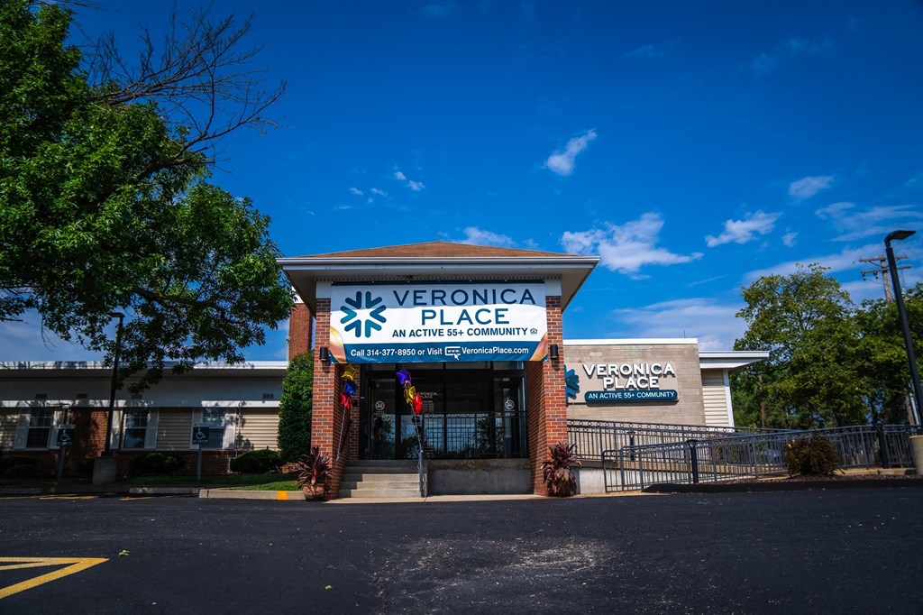 the front of the verona place building with a blue sky in the background