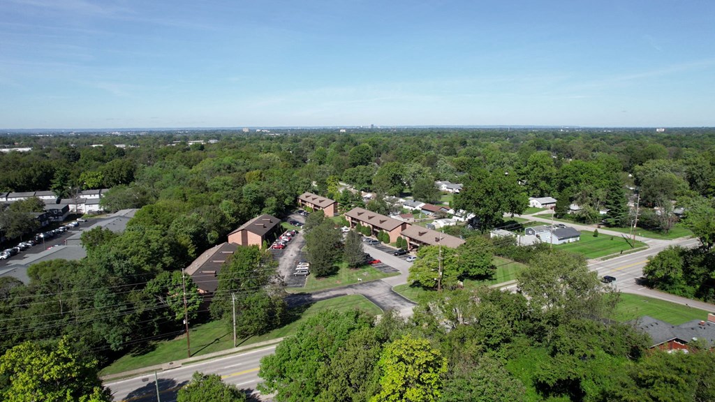an aerial view of a neighborhood with houses and trees