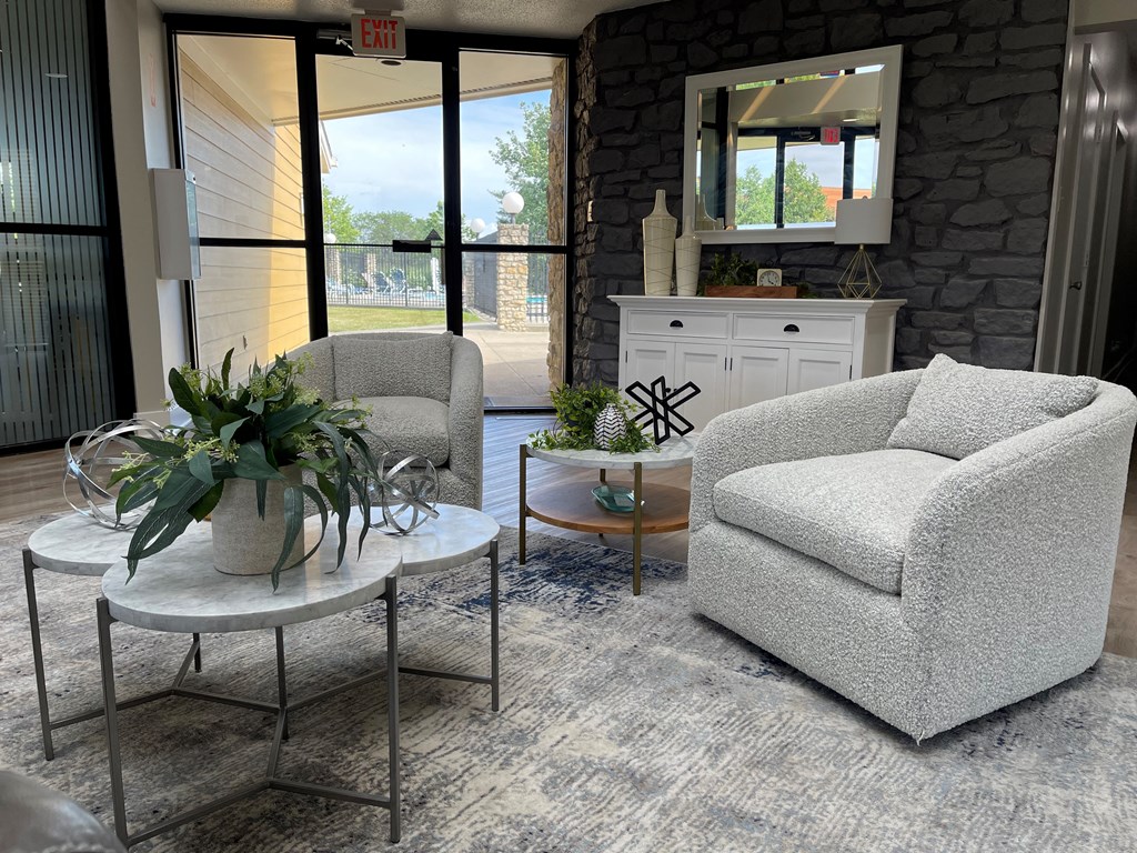 a living room with two chairs and a coffee table