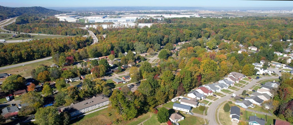 an aerial view of a neighborhood with houses and trees