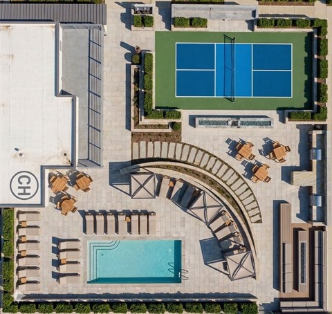 A pool and tennis court are seen from above.
