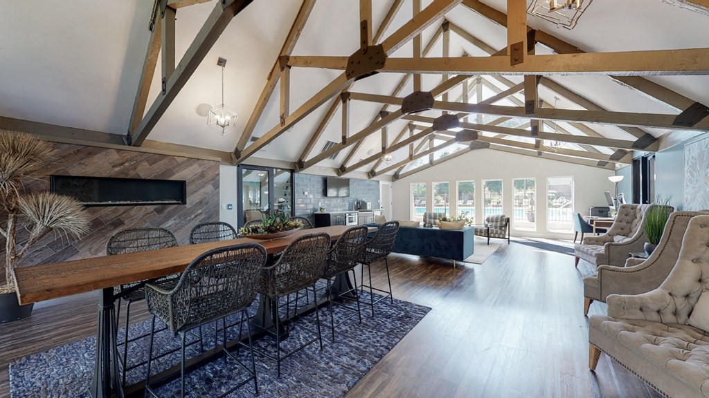 a large living room with a dining room table and a couch