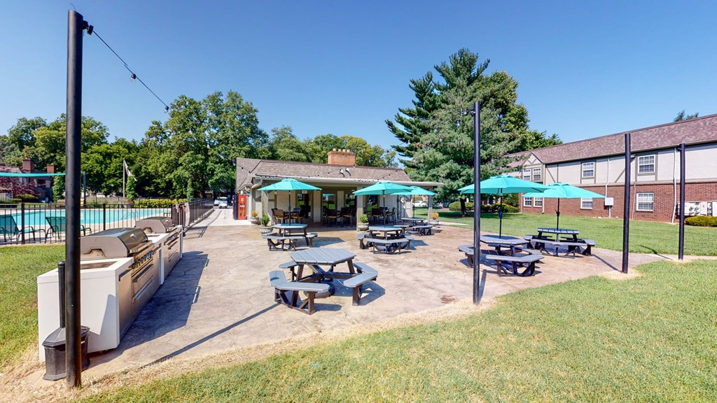 our apartments have a large patio with picnic tables and a pool