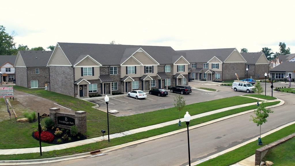 an aerial view of a row of houses on a street