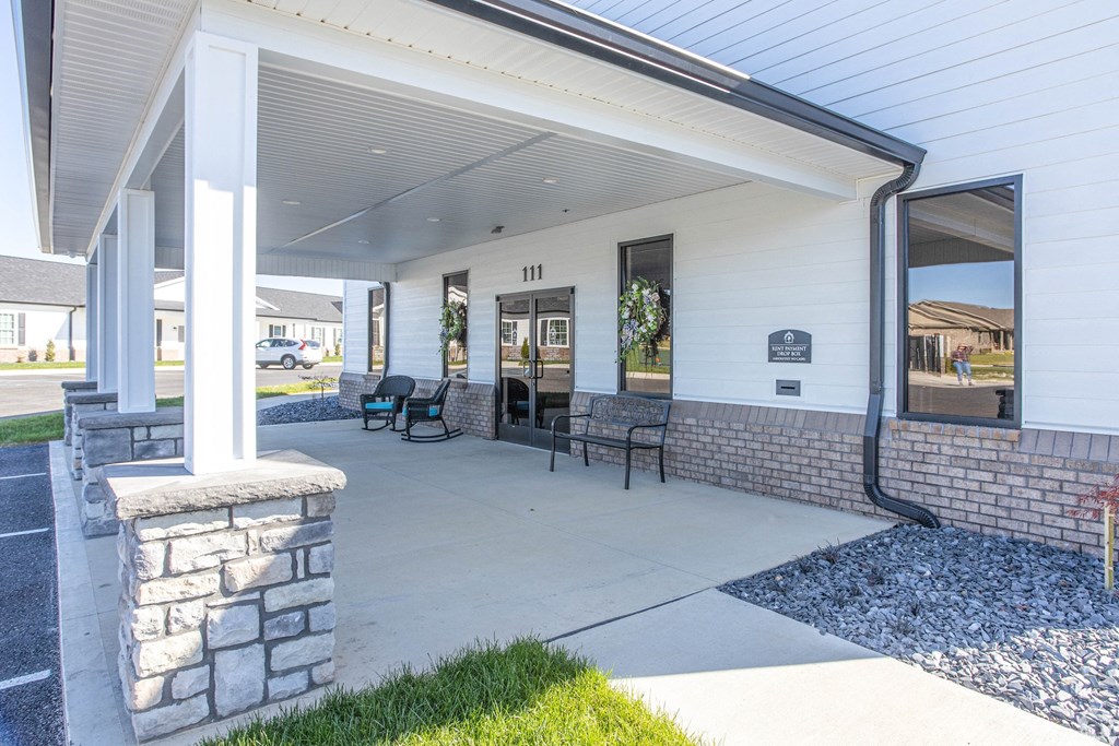 the preserve at ballantyne commons covered patio with stone columns and chairs