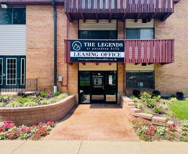 a brick building with a sign for the legends learning officer