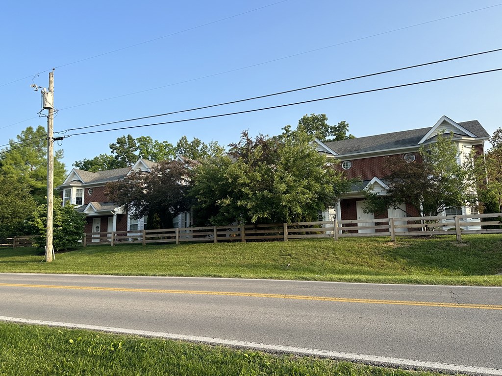 a row of houses on the side of a road