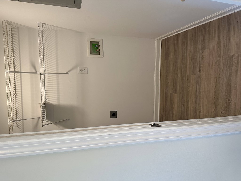 a reflection of a closet in a mirror in a bathroom