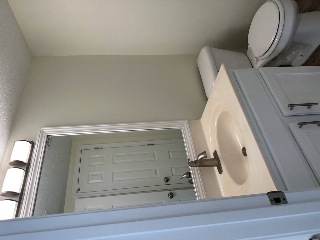 an overhead view of a bathroom with a sink and a toilet