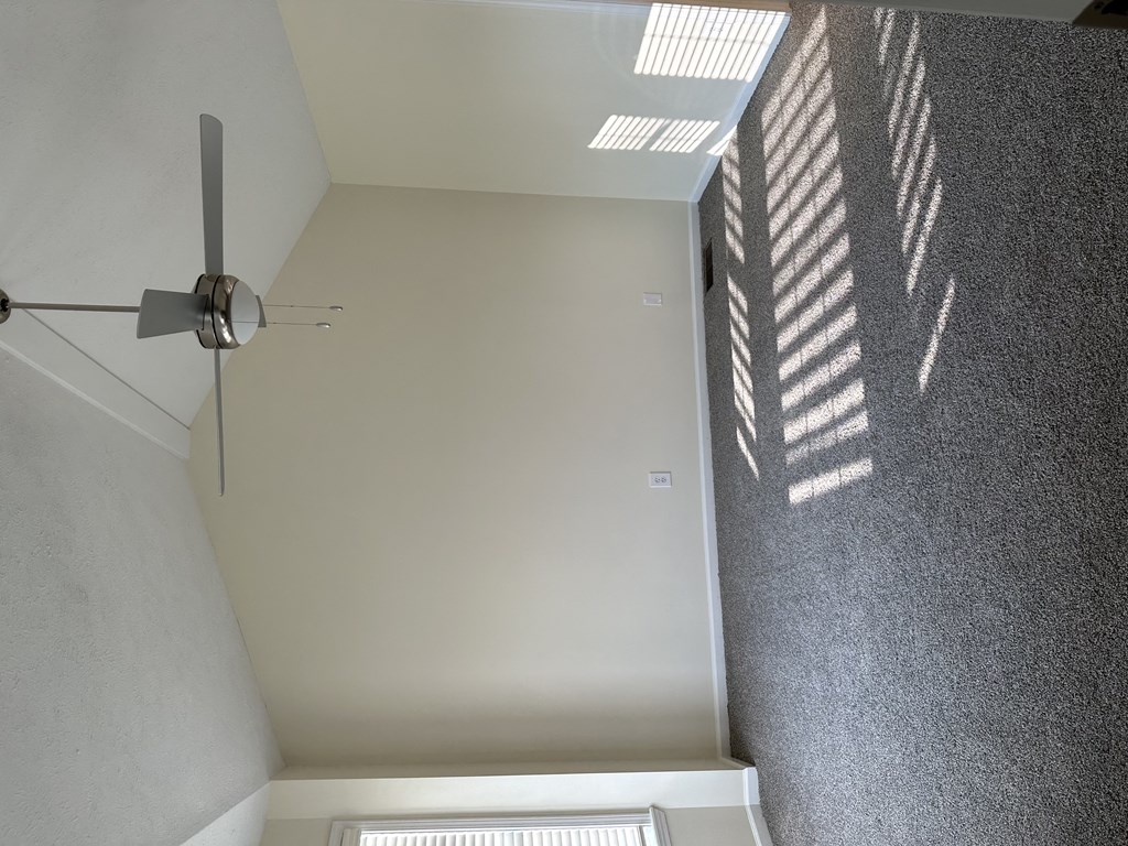 an overhead view of a room with a ceiling fan