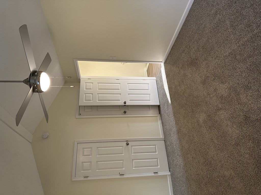 an overhead view of a closet and a ceiling fan