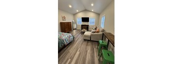 a living room with a couch and a table and a tv