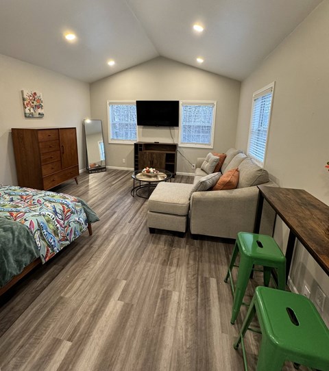 a living room with a couch and a table and a tv