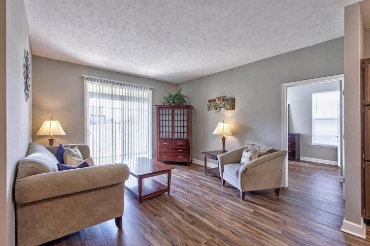 a living room with a couch and a chair