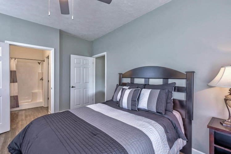 a bedroom with a bed and a closet