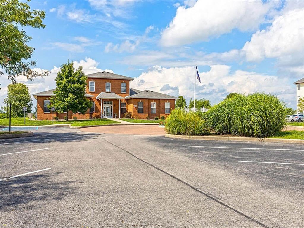 a large brick building with a street in front of it