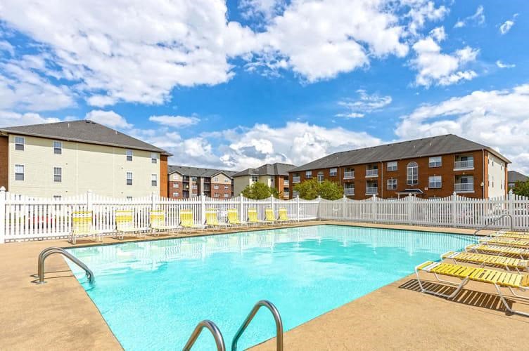 a swimming pool in front of a building
