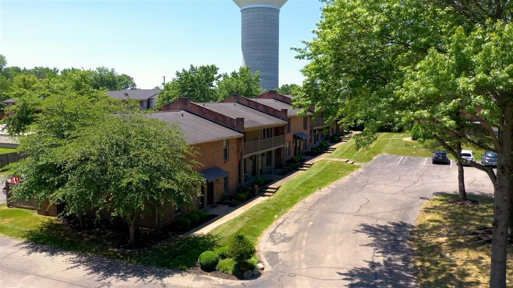 a row of houses with a water tower in the background