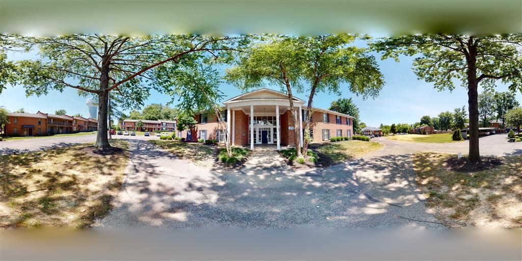 a picture of a building with trees in front of it