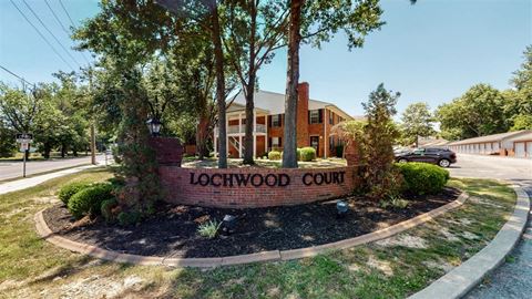a sign that says lockwood court in front of a building
