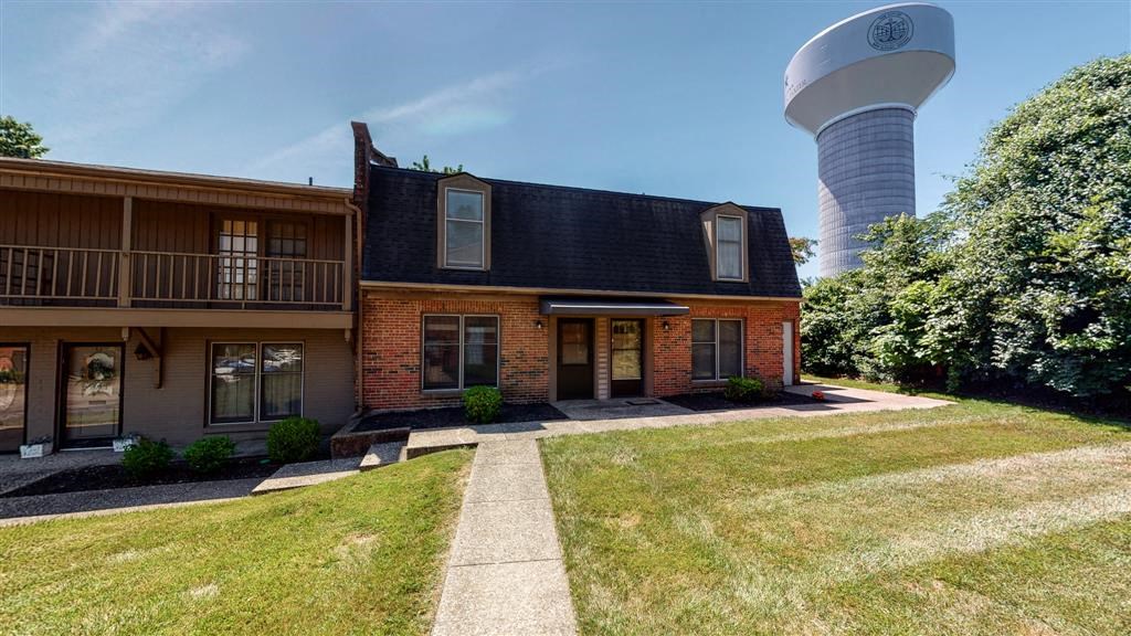 a house with a water tower in the background