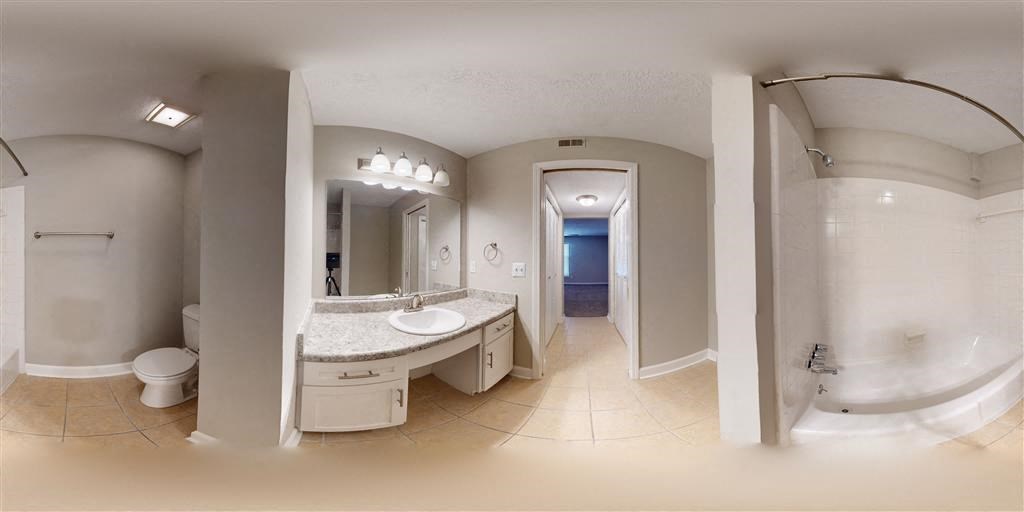 a bathroom with a sink and a toilet and a shower